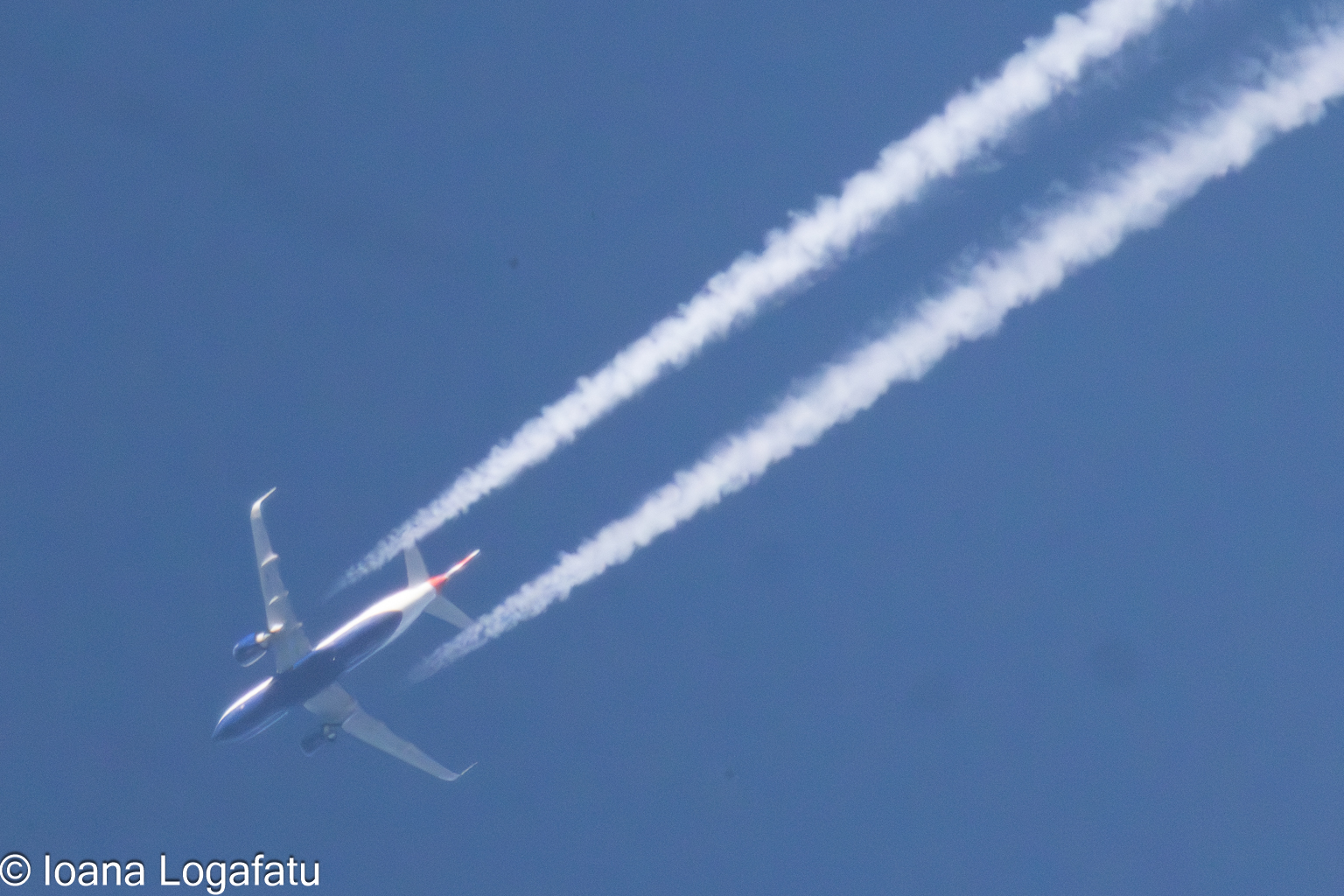 High above the clouds, a jet leaves its mark